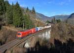 1116 034 mit einem Güterzug am 29.11.2014 bei Bad Hofgastein.