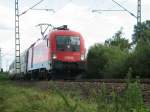 1116 021 mit EC 24 nach Dortmund Hbf nach dem stillgelegten Bahnhof Girching. Sommer 2006.