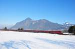 Der RJ nach Zrich durchfhrt am 23.01.10 das verschneite Inntal bei Niederaudorf, Zuglok 1116 217