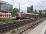 1116 226 schiebt am 24. Juni 2011 einen Railjet nach Budapest Keleti plyaudvar durch Mnchen-Heimeranplatz.