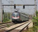 1116 138-9 rollt mit EC auf die Station Wien Haidestrae zu. Aufgenommen am 04.07.2012.