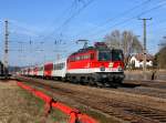 Die 1142 677 mit einem REX nach Linz am 16.03.2012 bei der Ausfahrt aus Schrding.