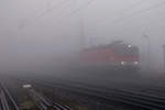 Aus dem dichten Nebel in Eichberg,taucht 1144.115 mit EC-151 am 25.11.17 auf.
