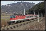 1144 039 mit IC518 bei Niklasdorf am 7.02.2019.