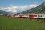 Ein schner REX: Eine unbekannte 1144er bringt den REX 5162 von Innsbruck Hbf nach Kufstein. Aufgenommen vor der Kulisse von Schwaz am 08.07.2008.
