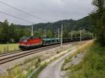 Die 1144 124 mit einem leeren Autozug am 29.06.2013 unterwegs bei Wernstein.