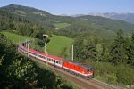 Die frisch ausgebesserte 1144.203 hat mit EC-151 vor der Kulisse der Rax und des Kreuzberges den Steinbauertunnel am Eichberg verlassen. 7.9.13