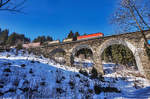 1144 209-4 überquert am Zugschluss vom EKOL, den Hundsdorfer-Viadukt bei Bad Hofgastein.