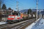 Sonntglicher Nahgterzug mit der 1163 010 bei Salzburg Sd am 23.01.2011.