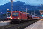 1216 142 vor EC 40465 (Zürich-Zagreb) beim Halt im Bahnhof Spittal-Millstättersee.