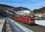 1216 027 &Manchester  1116 098 pass Salfaun whilst hauling freight train 44201 from Hall in Tirol to Verona Porta Nuova Scalo, 6 Feb 2018