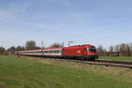 1216 007 war mit einem  EC  in Richtung Brenner unterwegs. Aufgenommen am 20. März 2024 bei Brannenburg im Inntal.