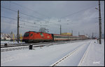 1216 007 beschleunigt den EC 31 aus dem frisch verschneiten Bahnhof Knittelfeld um den Zielbahnhof Venedig ein Stück näher zu kommen. 05.02.2016