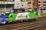 Die Hdlmayr-Werbelok der Wiener Lokalbahen aus sterreich mit einem Autotransporter bei der Ausfahrt in Wrzburg Hbf.