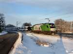Die 1216 954 mit einem Autozug am 19.01.2013 unterwegs bei Pleinting.