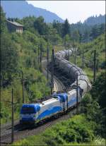 1216.920 und 1216.921 mit dem 48184 (Tbv-He) am 27.07.13 kurz nach dem Bhf.