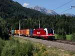 Die 1216 940 mit einem Containerzug am 12.09.2015 unterwegs bei Bischofshofen.