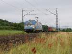 Der ADRIA Taurus 1216 920 bespannte am 10.07.2014 einen Containerzug in Fahrtrichtung Norden. Aufgenommen bei Harrbach. 