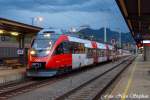 4023 003-9 als R 3599 Schwarzach-St.Veit - Schladming im Bahnhof von Schwarzach-St.Veit,whrend sich im Hintergrund ein krftiger Wolkenbruch zusammenbraut (sterreichurlaub 08.08.09)