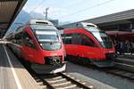Während der ÖBB 4024 070-7 als REX nach Steinach in Tirol auf Gleis 5 im Innsbrucker Hauptbahnhof stand, wartete der ÖBB 4024 026-9  S-Bahn Vorarlberg  als REX nach Wörgl Hbf) auf