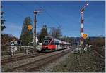 Der ÖBB ET 4024 099-6 passiert die Einfahrsignale von Lindau Reutin und erreicht in Kürze sein Ziel Lindau Hbf. 

16. März 2019