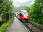 4024 013-7 hlt als REX 3412 Richtung Stainach-Irdning in Ebensee Landungsplatz.