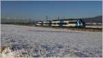 4024 120   S-Bahn Steiermark  fhrt als R 4210 (Judenburg-Graz Hbf) durch das angezuckerte Murtal. 
St.Margarethen 16.1.2012