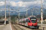 4024 057-4 mit S-Bahn 1 Telfs-Pfaffenhofen-Kufstein auf Wrgl Hauptbahnhof am 31-7-2013.