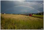 Auf Regen da folgt Sonnenschein - Und der Fotograf freut sich über den wunderbaren Regenbogen, unter welchem 4024 039 als Regional Express in Richtung  Friesach braust.