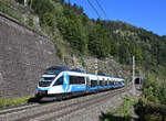 Hier zu sehen der f�r die S-Bahn Steiermark werbende 4024 039 als S 8  auf seiner Fahrt von Bruck an der Mur nach Judenburg, fotografiert kurz nach dessen Ausfahrt aus dem im Hintergrund zu sehenden