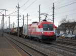 Vom Terminal Wels gekommen und in Richtung Linz unterwegs  war am 26.03.2008 die 1116 005  EM-sterreich  mit einem  Containerzug in Marchtrenk.