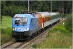 ber die Summerauerbahn fhrt 1116 250  Feuerwehr  mit IC 101  Anton Bruckner  von Prag nach Linz.
Freistadt 9.8.2010