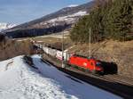 Die 1116 142 mit einer RoLa am 23.02.2019 unterwegs bei Matrei am Brenner.