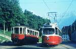 Straßenbahn Innsbruck___Tw 3  der Linie 6 (Mittelgebirgsbahn) und ein  kurzer Lohner  an ihren Haltestellen in Bergisel.__10-08-1972