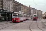 Wien WVB SL B (E1 4867) / SL 26 (E1 4723 + c2 1034) I, Innere Stadt, Schwedenplatz im Oktober 1979. - Der E1 4867 wurde am 3. März 1977 geliefert. Seit 26. März 2009 fährt er als SL VRT. - Der E1 4723 wurde am 20. Oktober 1969 geliefert. Ausgemustert wurde er am 22. November 2002. Danach kam er nach Miskolc. - Scan von einem Farbnegativ. Film: Kodacolor II. Kamera: Minolta SRT-101.