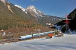 "Ski Austria" 1116 251 mit RJ bei Schnann,im Hintergrund ist die Blankaspitze zu sehen,in diesem Fall können Hochspannungsmasten auch mal reizvoll sein...Bild vom 12.3.2105