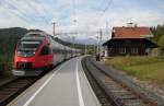 4024 091-3 als S5 der Tiroler Schnellbahn verl��t am 4.10.2012 am sp�teren Nachmittag mit Ausgangspunkt Seefeld in Tirol die Haltestelle Reith auf der Fahrt nach Innsbruck.