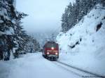 Regionalbahn 5427 mit 111 023 am 4.1.2006 von M�nchen Hbf nach Innsbruck Hbf bei der Einfahrt in Gie�enbach 