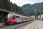 Einfahrt am Morgen des 04.07.2018 von ÖBB 4024 060-8 zusammen mit ÖBB 4024 059-0 als REX (Brenner/Brennero - Innsbruck Hbf/Wörgl Hbf) in den Bahnhof von Steinach in Tirol.