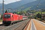 Am 03.07.2018 fuhr 1216 021 (E 190 021) zusammen mit 1216 022 (E 190 022) und einem EuroCity nach Italien durch den Bahnhof von Matrei am Brenner in Richtung Brennero.