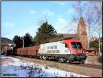 An der Donawitzer Kirche vorbei fhrt die 1016 047  Wiener Stdtische  mit dem Leererzzug 47407 nach Spielfeld Strass. 15.02.2009 