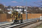Bahnbau Wels 2-Wege-Bagger Liebherr Litronic 900 verlässt soeben die Baustelle bei Ingling Richtung Wernstein am Inn, Passauer Bahn ÖBB KBS 150 Passau - Wien, fotografiert am 16.03.2013
