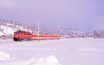 ÖBB 1042 050-3 vor Zug 5012 (Salzburg Hbf - Wörgl) unterwegs bei Brixen im Thale am 24.01.2000.