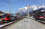 BB 1144 227-6 verlsst gerade als S3 Schwarzach-St. Veit - Freilassing den Bahnhof, whrend rechts BB 4023 002-1 auf den nchsten Einsatz wartet, KBS 201 Innsbruck - Saalfelden, fotografiert im Bhf. Bischofshofen am 07.03.2012