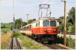 Die 1099.14  Rosinante  fhrt mit R 6802  Mariazeller Land  von Mariazell nach St.Plten. 
Hofstetten-Grnau 4.7.2010