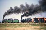 CLUB 760 699.01 und GEG 699.103 kurz nach der Ausfahrt aus Obergrafendorf auf der  Krumpen . Aufgenommen wrend der Feierlichkeiten  100 Jahre Schmalspurbahnen in sterreich  vom 11. bis 15. August 1989 im Bf. Obergrafendorf. (Diascan)