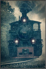 Durch die dicken Tropfen schlängelt sich 764.411R an diesem gewittrigen Nachmittag im Juli.