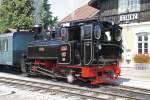 764.411R steht am 3.07.2015 vor dem Bahnhof Stainz.