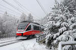 Den frisch verschneiten Bhf.Semmering verlässt 4023.011 als Reg.nach Payerbach/R. 14.1.18