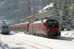 1116.244  mit  Garnitur 44  als  RJ-650  im  tief  verschneiten  Bhf.